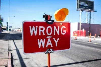 red Wrong Way signage on road by Kenny Eliason on unsplash